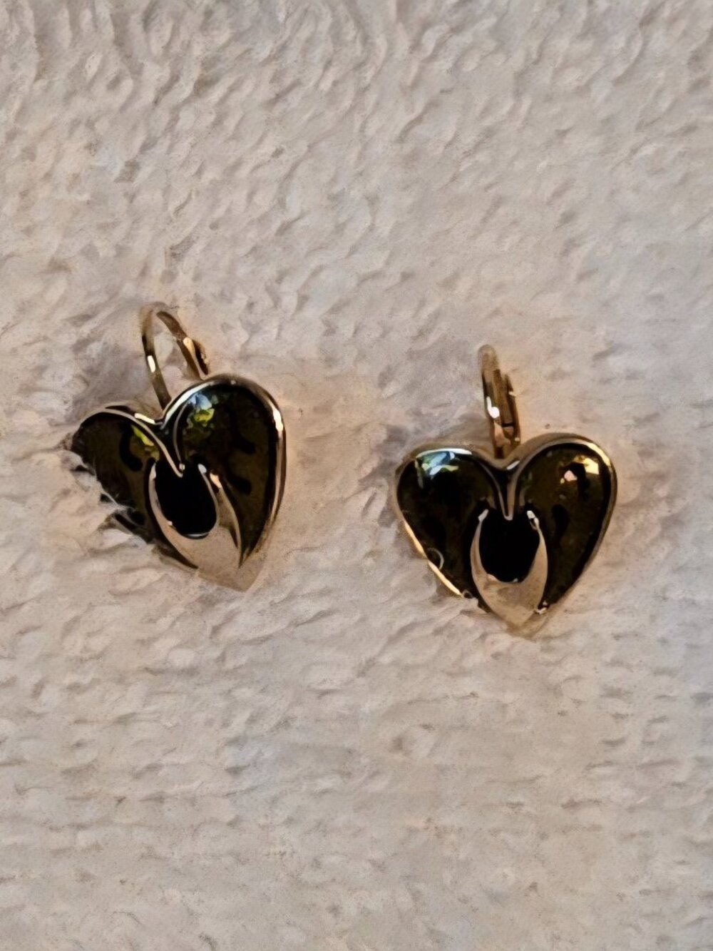 Gold tone heart shaped earrings